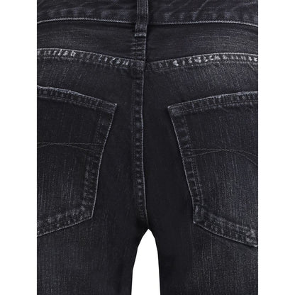 Close-up of Balenciaga Black Cotton Relaxed Fit Jeans showing faded denim and pocket details.