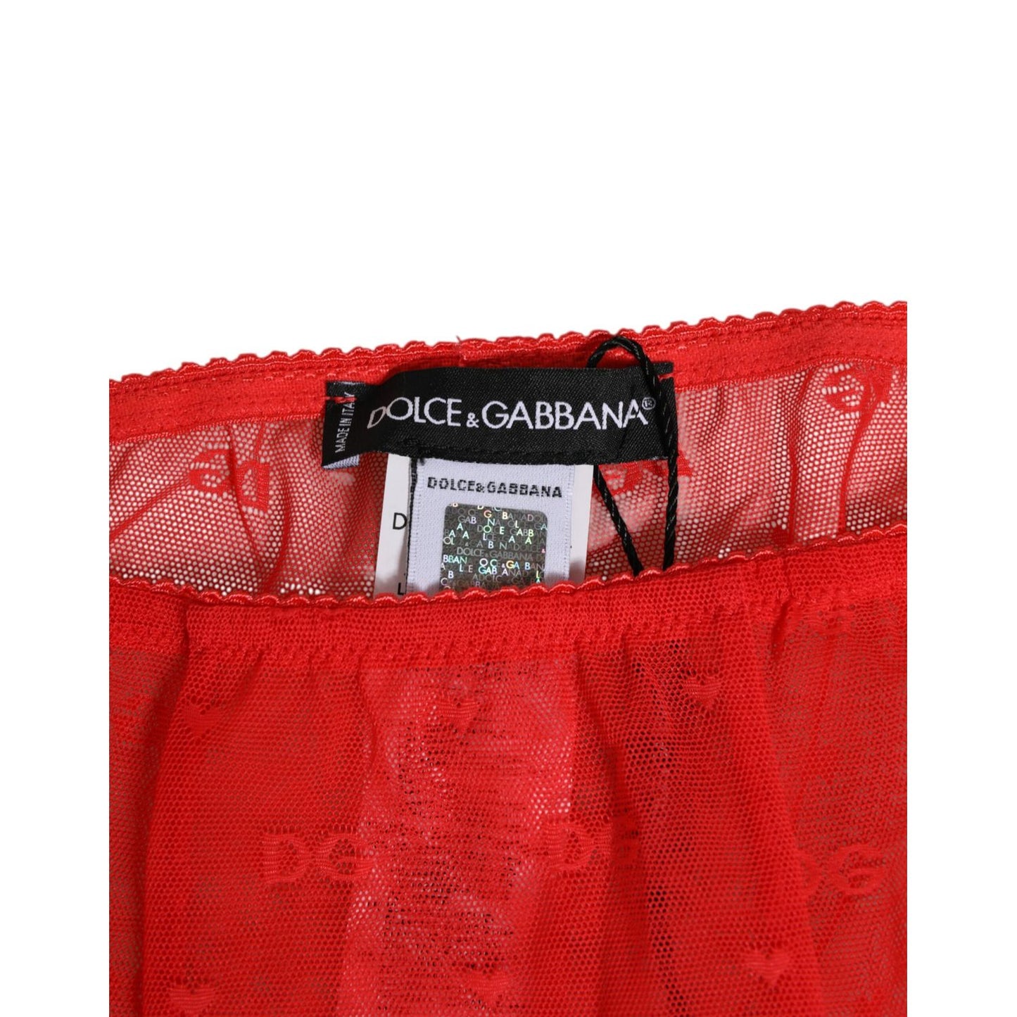 Close-up of Dolce & Gabbana Red Nylon Logo Lace Leggings Pants Underwear showcasing brand tag and red lace detail.