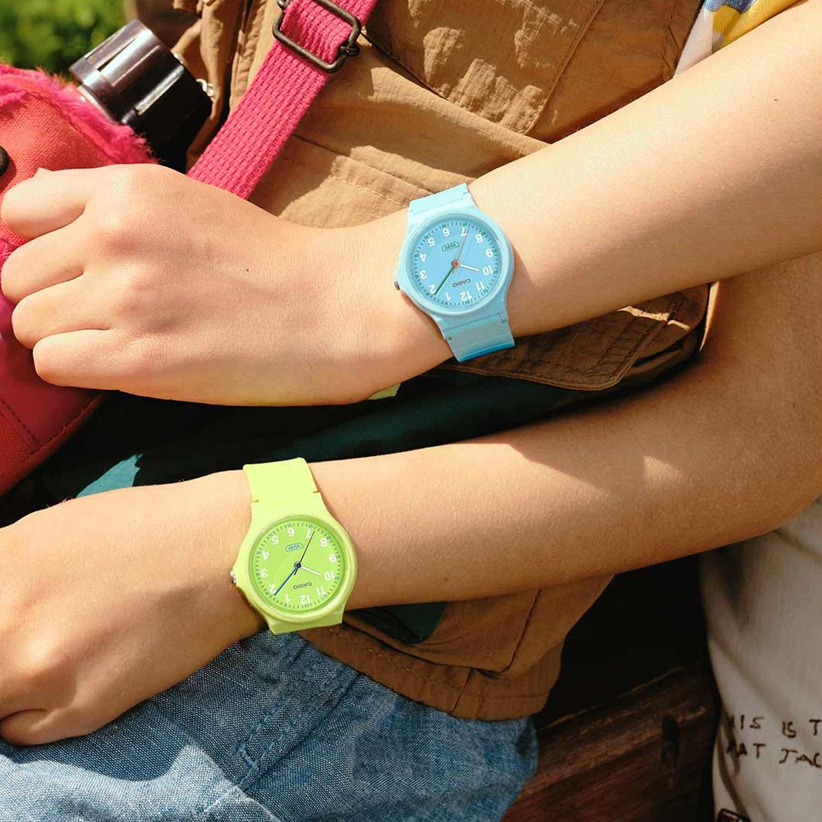 Alt Tag: CASIO TIMELESS COLLECTION Mod. POP - BIO RESIN STRAP - LEMON GREEN on wrist, paired with another colorful watch.