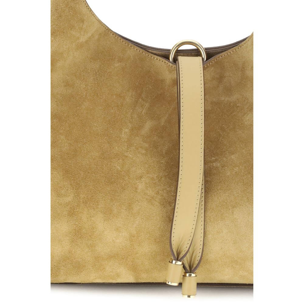 Close-up of Chloé Beige Calf Leather Bos Taurus Shoulder Bag with suede texture and tasseled closure detail.