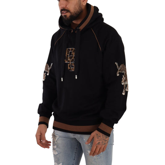 Man wearing Dolce & Gabbana Black Brown Leopard Cotton Hooded Pullover Sweater with leopard motifs and logo detailing.