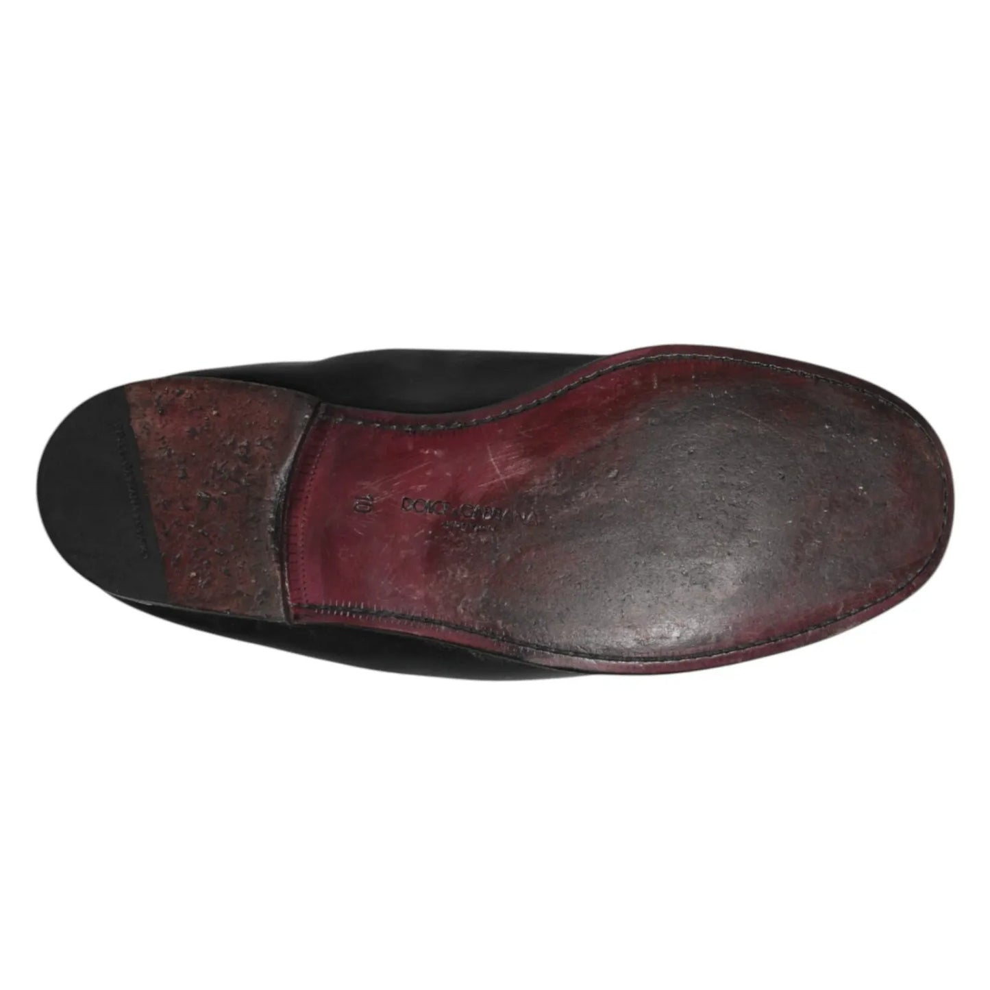 Sole view of Dolce & Gabbana Black Leather Slip On Men Flat Loafers Shoes showing minor wear.