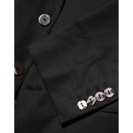 Close-up of Dolce & Gabbana Black Single Breasted Men Coat MARTINI Blazer with buttons and fabric details.