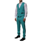 Model wearing Dolce & Gabbana Cyan 3 Piece Wool Silk Blend Suit SICILIA with vest and pants, tailored in Italy for luxury events.