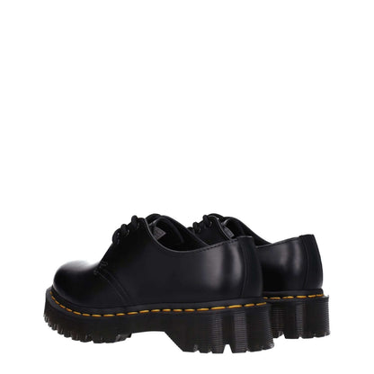 Dr. Martens Black Leather Oxfords And Derbies, lace-up shoes with rubber sole and mid heels, casual style for men and women.