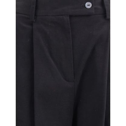 Close-up of Ella Black Cotton Casual Pants showcasing front pleats, zip button closure, and wide leg design for an elegant silhouette.