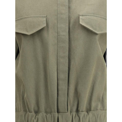 Close-up of Ella Green Cotton Jumpsuit featuring concealed button front and functional front welt pockets with flaps.