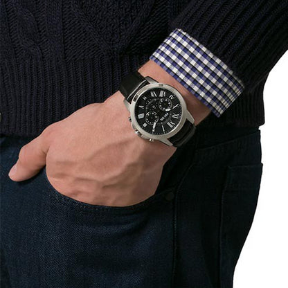 Gent wearing FOSSIL WATCHES Mod. FS4812 with leather strap and stainless steel case, showcasing a stylish chronograph design.