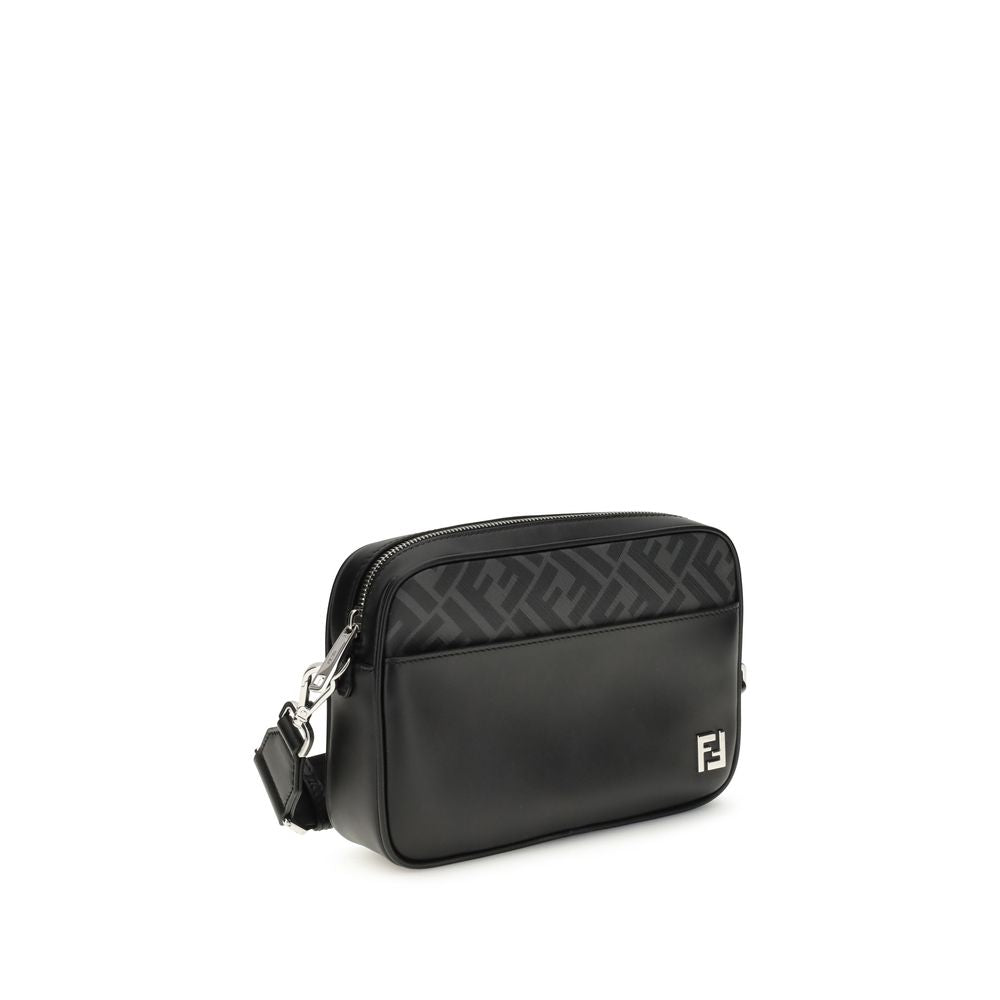 Fendi Black Leather Shoulder Bag with metal FF logo, featuring smooth leather and FF canvas, adjustable crossbody strap, and zippered compartment.