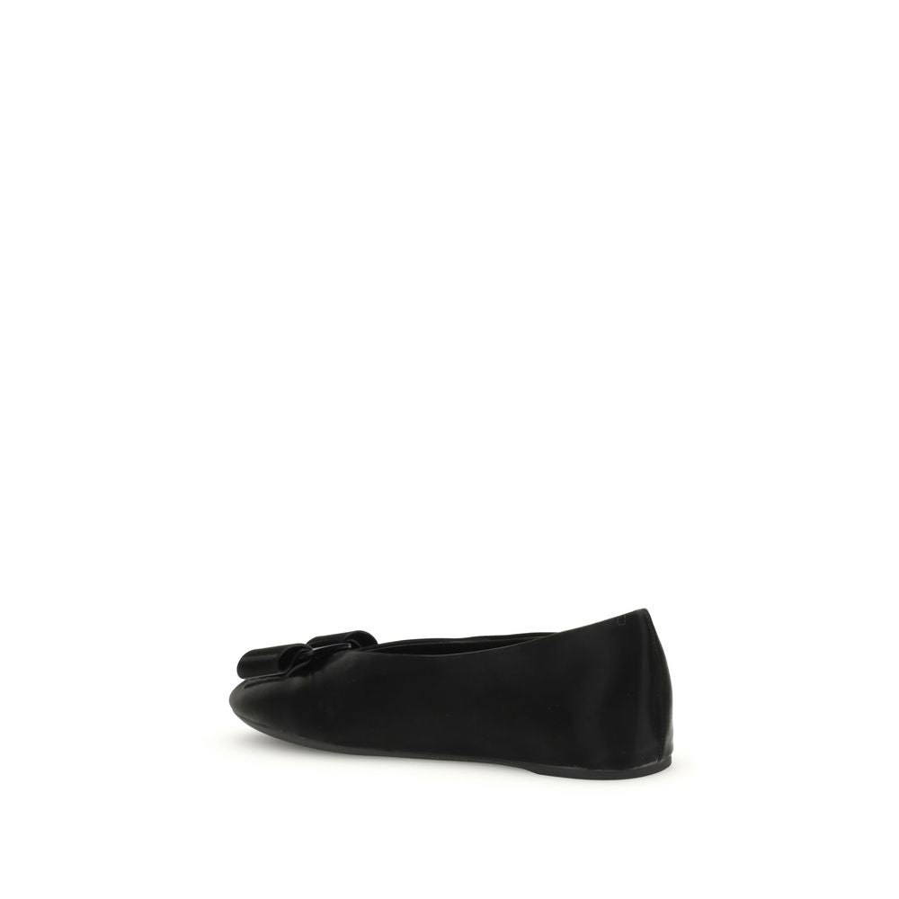 Side view of Ferragamo Black Calf Leather Bos Taurus Ballet Flats with Vara bow detailing and flexible unstructured fit.