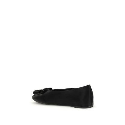 Side view of Ferragamo Black Calf Leather Bos Taurus Ballet Flats with Vara bow detailing and flexible unstructured fit.