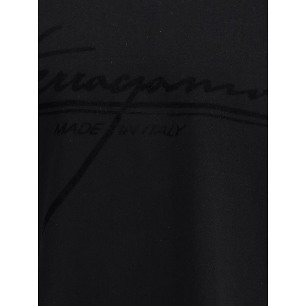 Close-up of Ferragamo Black Cotton T-Shirt with iconic tone-on-tone brand signature, showcasing its minimal elegance and sophistication.