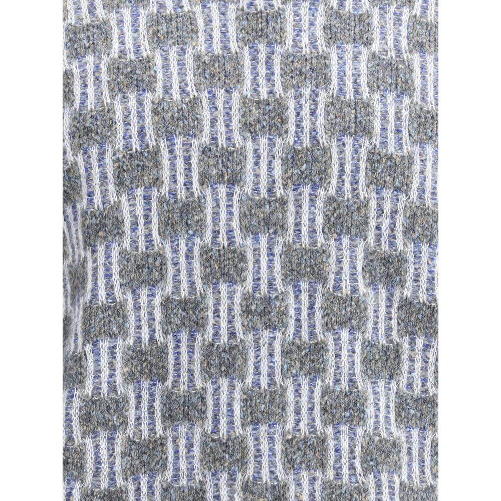 Close-up of Giorgio Armani Light Blue Cotton Turtleneck fabric texture showing two-tone graphic pattern and refined knit details.