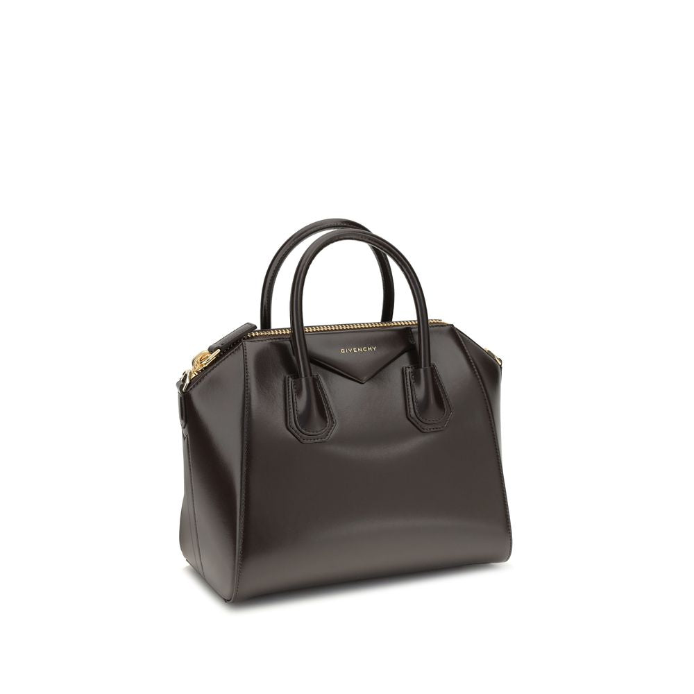 Givenchy Brown Calf Leather Bos Taurus Handbag with glossy finish, featuring round handles, zipper closure, and shoulder strap.