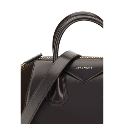 Close-up of Givenchy Brown Calf Leather Bos Taurus Handbag with logo, glossy calfskin finish, handles, and shoulder strap detail.
