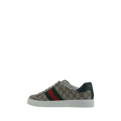 Gucci Beige Rubber Low Top Sneakers with lace-up front, GG jacquard fabric, leather logo detail, on a white platform sole.