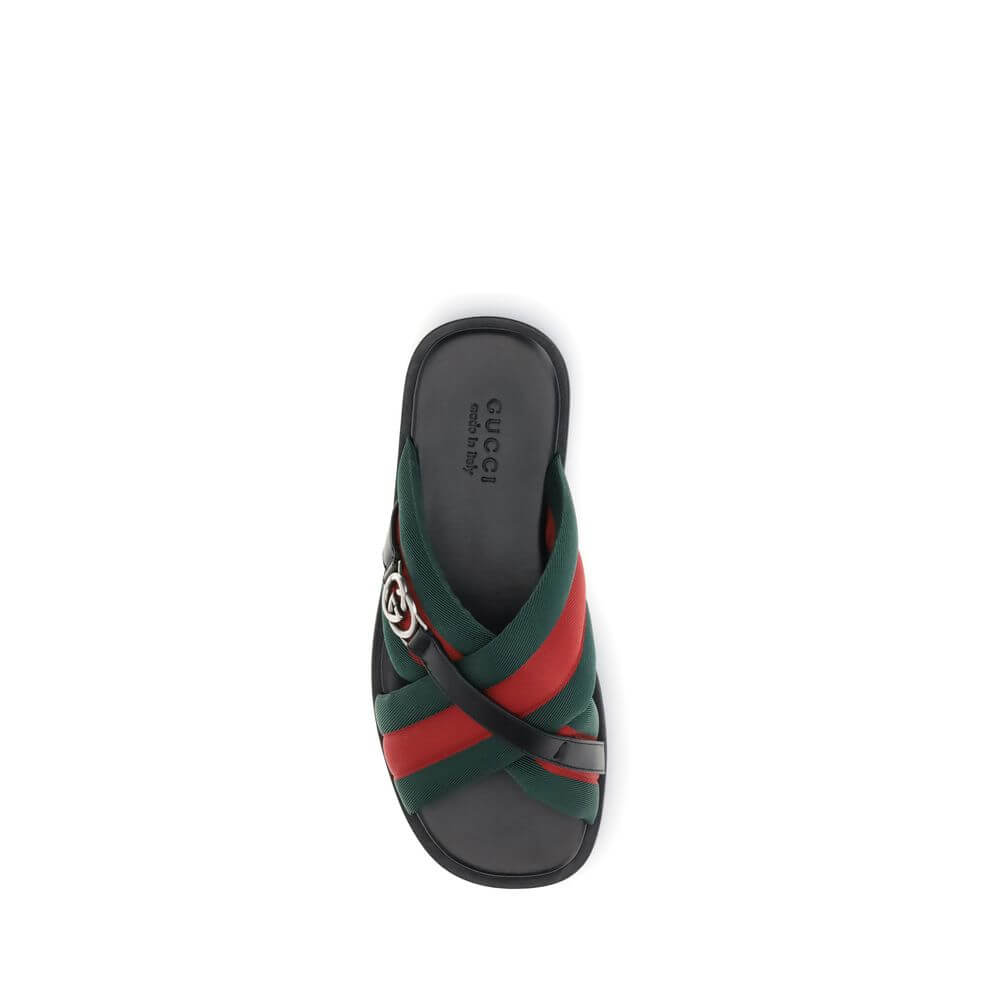 Gucci Black Polyamide Flat Sandals with green and red Web fabric and silver-tone GG logo, top view.