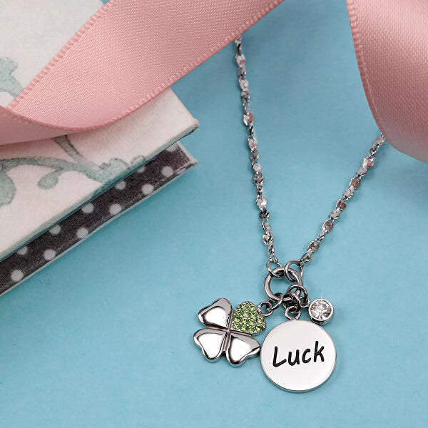 LA PETITE STORY JEWELRY Mod. LPS05ARR62 necklace with butterfly and 'Luck' charms on a pastel background