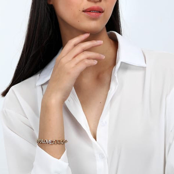 Woman wearing LA PETITE STORY JEWELRY Mod. LPS05ASD35 bracelet with white blouse, showing off elegant design.
