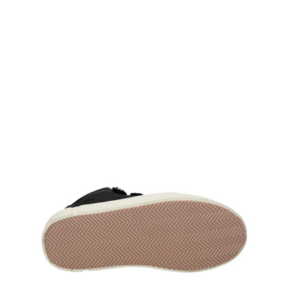 Marcelo Burlon Black Leather Low Top Sneakers with rubber sole, aged and vintage effect, showing bottom tread design.