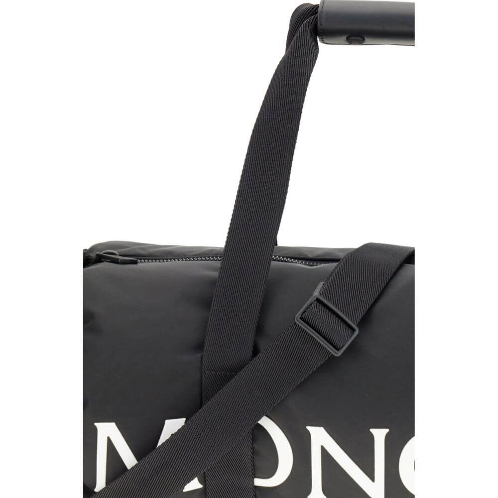 Moncler Black Nylon Luggage And Travel bag with adjustable strap and logo detail.