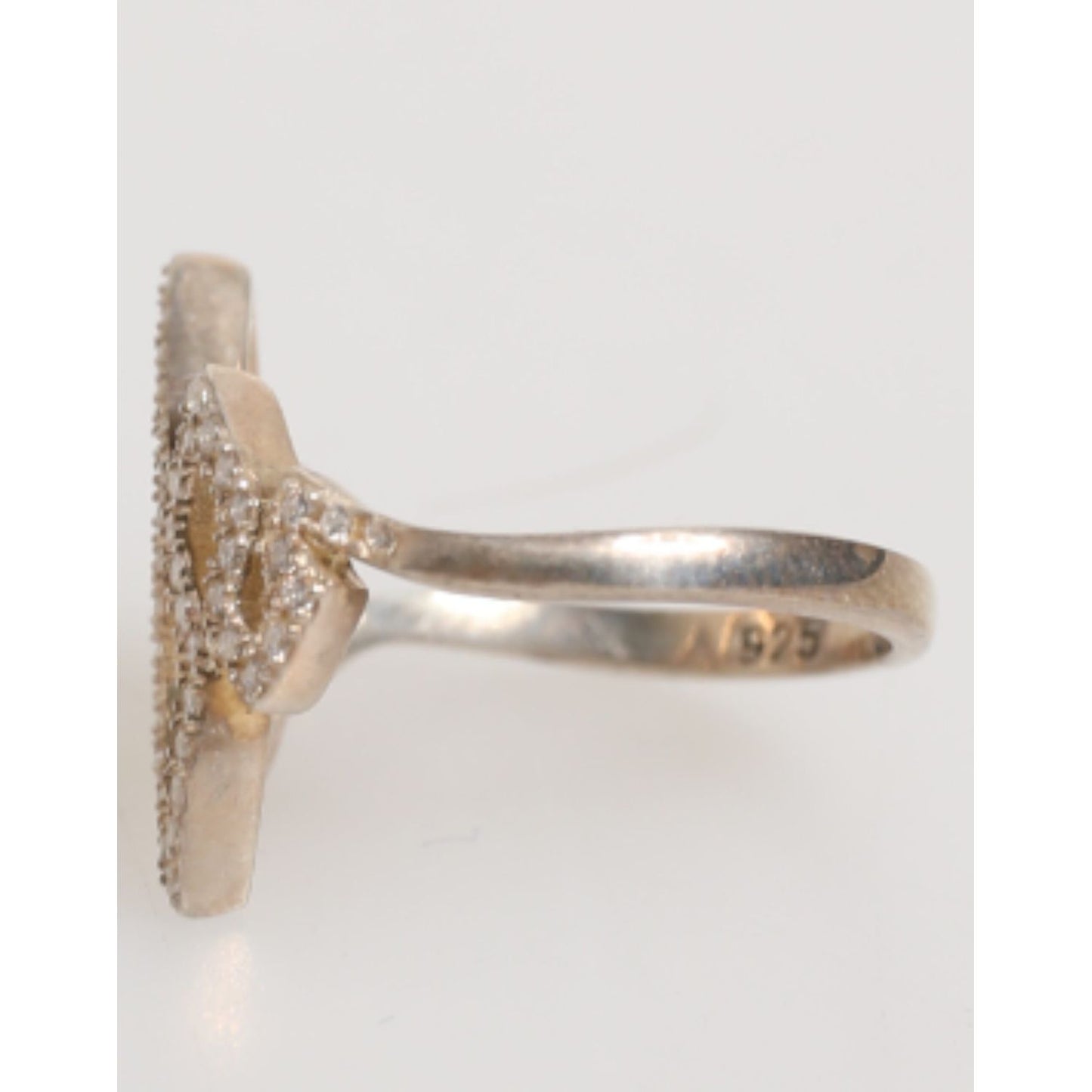 Side view of Nialaya Geometric Diamond Shape Pave CZ Crystal Jewelry Ring in 925 Silver and gold, showcasing cubic zirconia crystals.