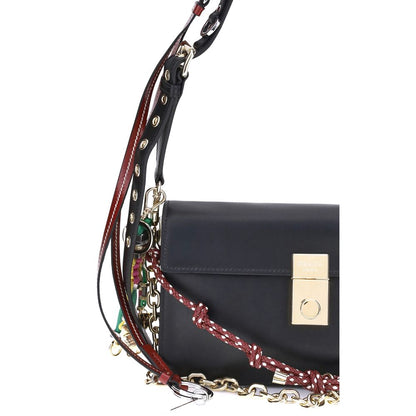 Prada Black Calf Leather Bos Taurus Shoulder Bag with metallic logo and decorative strap details.