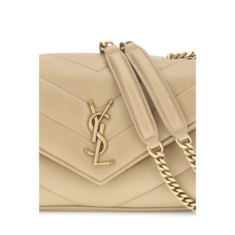 Close-up of Saint Laurent Beige Lamb Ovis Aries Aries Shoulder Bag with quilted design and YSL brass logo.