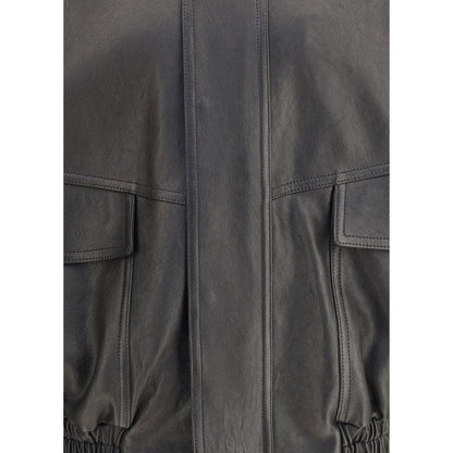 Close-up of black leather fabric and pockets on Saint Laurent Black Lamb Ovis Aries Aries Clothing jacket.