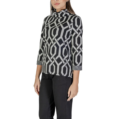Woman wearing Street One Black Polyester Sweatshirt with geometric jacquard pattern and scarf collar, showcasing style and comfort.