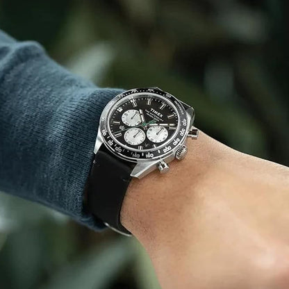 Person wearing TIMEX WATCHES Mod. TW2V42500 with black strap on wrist, showing the watch's stylish design and chronograph features.