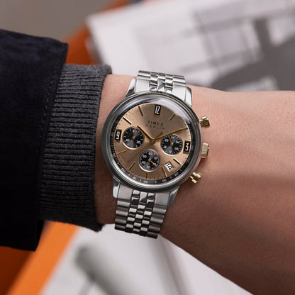 Person wearing TIMEX WATCHES Mod. TW2W60100 with silver and gold tone features on wrist