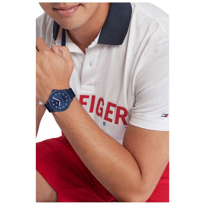 Gent wearing TOMMY HILFIGER Mod. 1792022 watch with blue dial and bracelet, showcasing style and functionality.