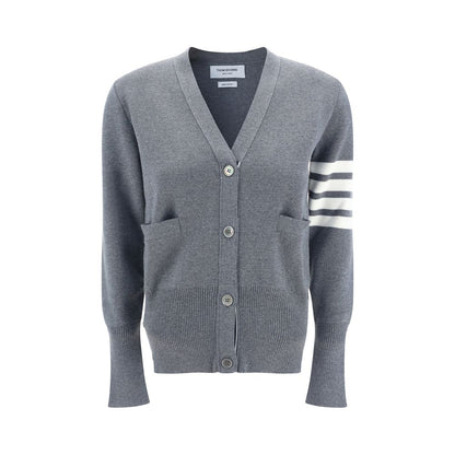 Alt Tag: Thom Browne Gray Fleece Wool Cardigan with contrasting buttons, open front pockets, V-neck, and brand bands on arm.