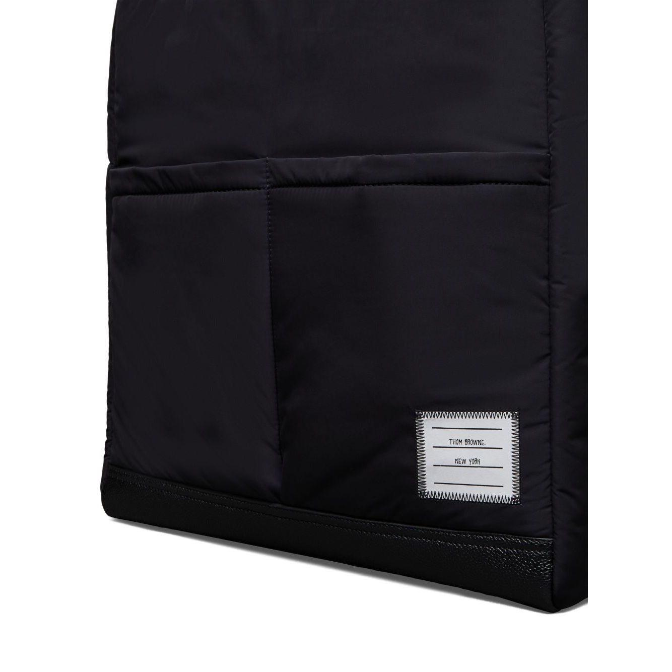 Thom Browne Multi pocket tote bag with two front patch pockets in black, featuring two top handles and internal zip-fastening pocket.