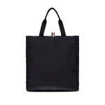 Thom Browne Multi pocket tote bag with two top handles and front patch pockets, in black, includes internal zip pocket and dust bag.