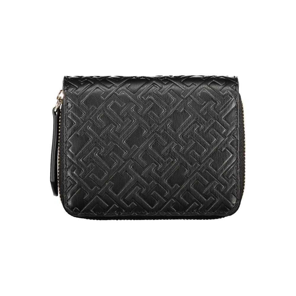 Tommy Hilfiger Black Polyethylene Wallet with coin purse, card spaces, and zip closure, featuring contrasting details and logo.