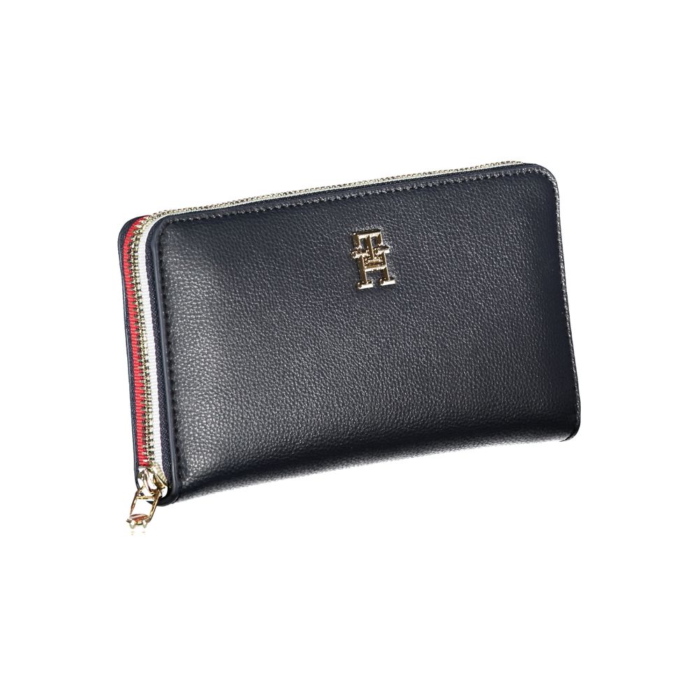 Tommy Hilfiger Elegant Blue Designer Wallet with zip closure and gold emblem, offering style and functionality for the modern individual.