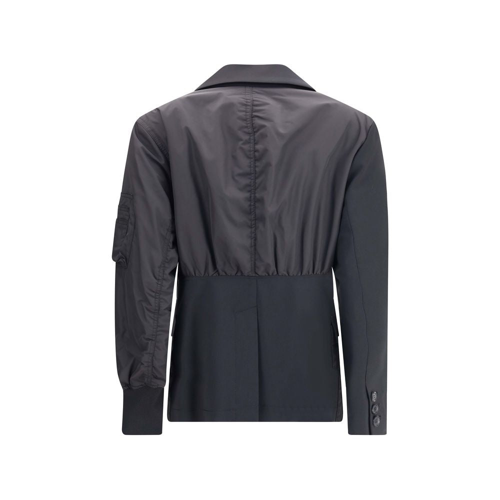 Back view of Undercover Black Polyester Bomber jacket with hybrid blazer design and zippered sleeve pocket.