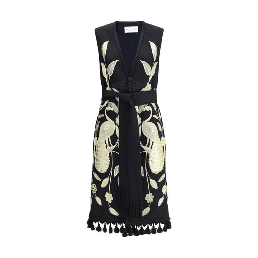 Valentino Embroidered long Vest with gold embroidery, frog closure, tassel hem, and fringed scarf, depicting sartorial elegance and artistry.