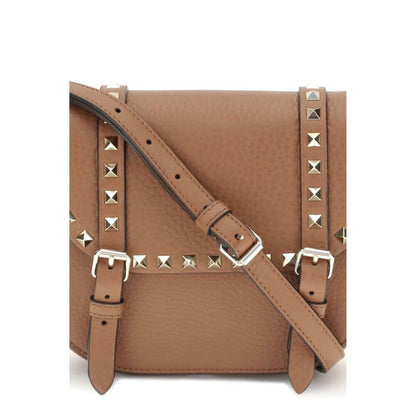 Valentino Garavani Beige Calf Leather Bos Taurus Shoulder Bag with rockstuds and adjustable strap, showcasing front flap closure.