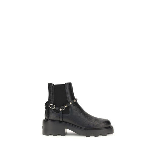 Valentino Garavani Black Calf Leather Bos Taurus Ankle Boots with metal studs and elastic inserts, AW25 collection, side view.