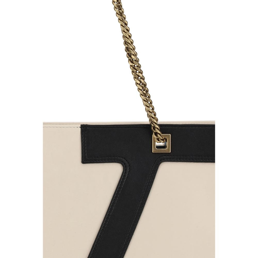 Close-up of Valentino Garavani Cream Lamb Ovis Aries Aries Shoulder Bag with chain and VLogo detail.