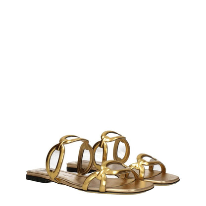 Valentino Garavani Gold Leather Slippers, open toe design, low flat heel, luxurious casual style in premium gold leather.