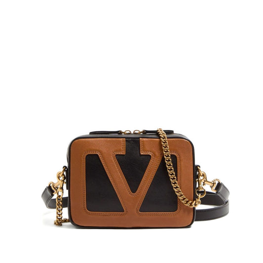 Valentino Garavani Viva Superstar leather camera bag with detachable chain-link strap and adjustable shoulder strap in black and brown.