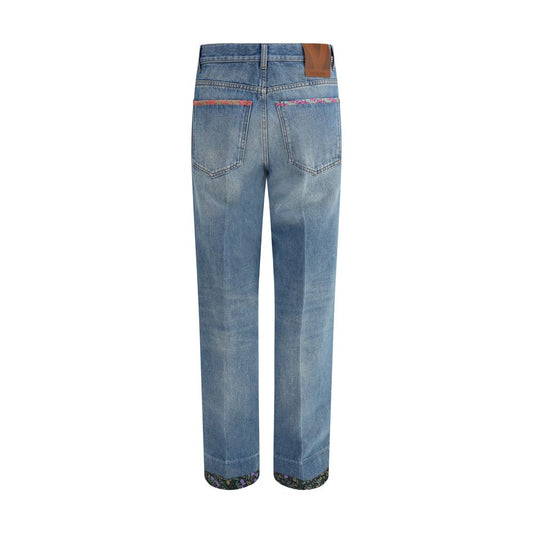 Back view of Valentino Jeans with floral details showing logoed label and floral applique on pockets and bottom.