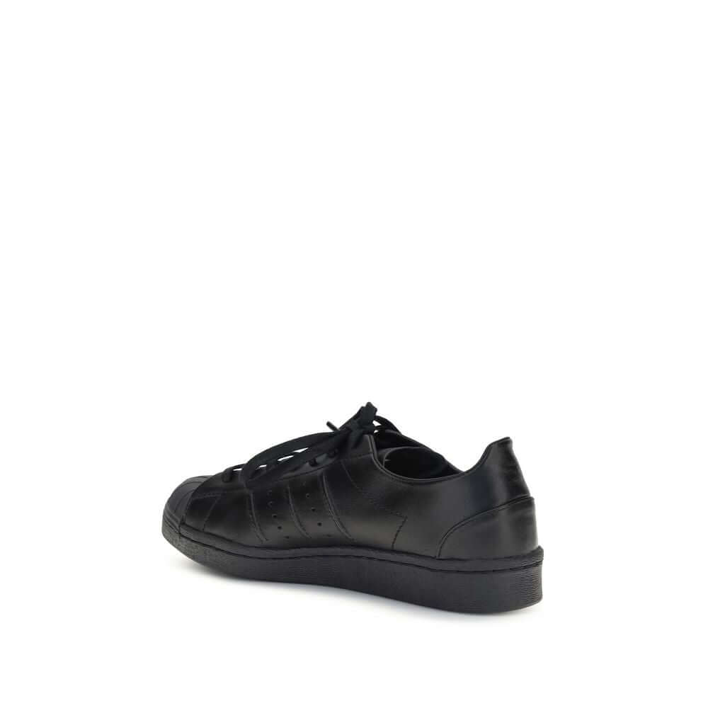 Y-3 Black Calf Leather Bos Taurus Sneakers with rubber shell toe, sleek design.